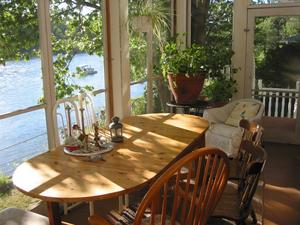 Summer dining table on the screened porch