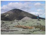 Summit cairn on Skylight, with Marcy in the background