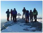 Group photo by the summit sign